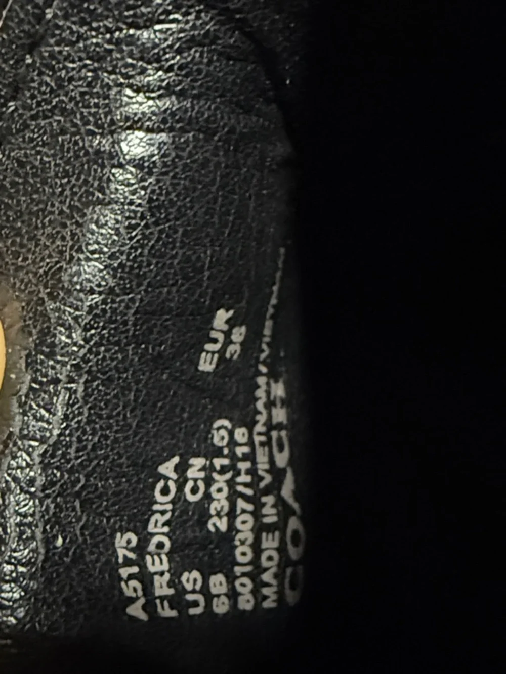 Coach Black Leather Slip-On Loafers with Silver Plaque